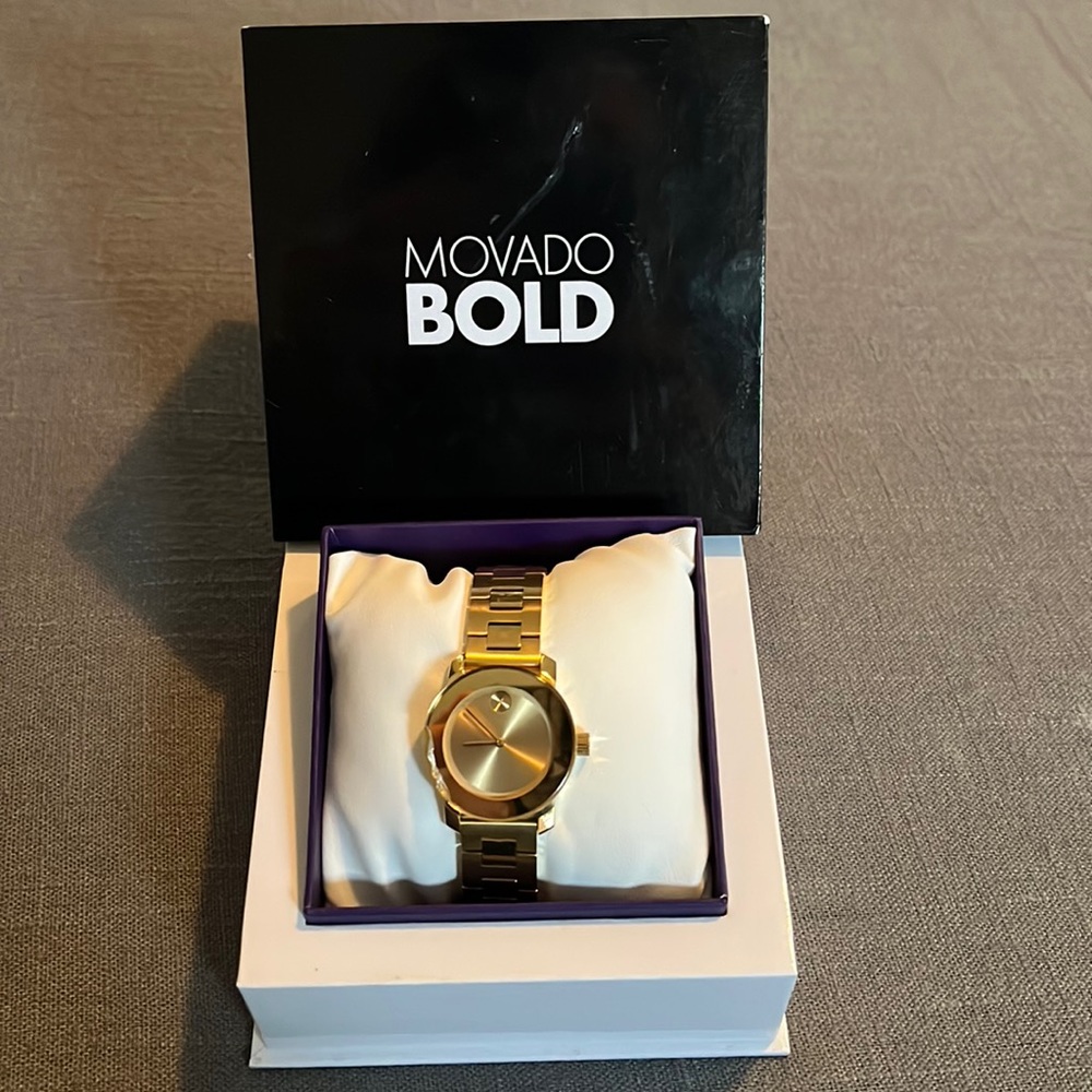 Movado Bold. Crack on left side of face.